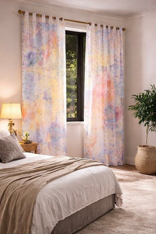 Bedroom with floral curtains, bed, lamp, and plant.