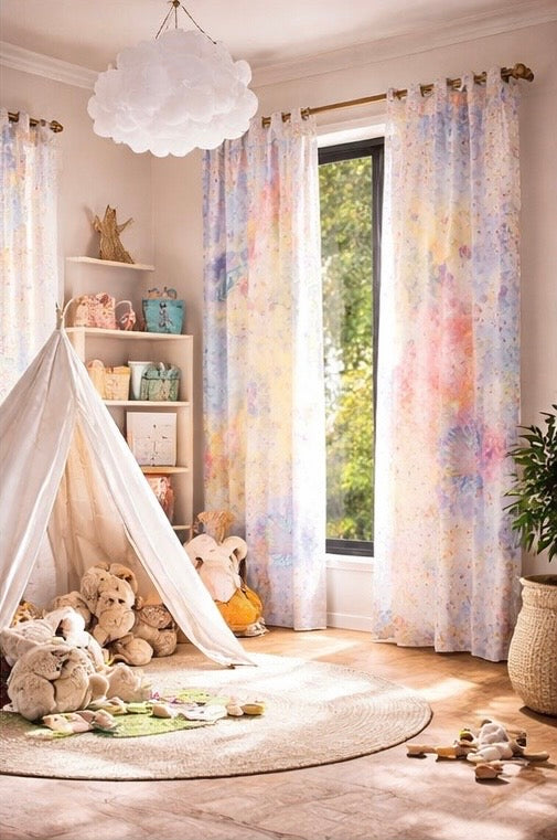 Children's room with colorful curtains, teddy bears, and a teepee.