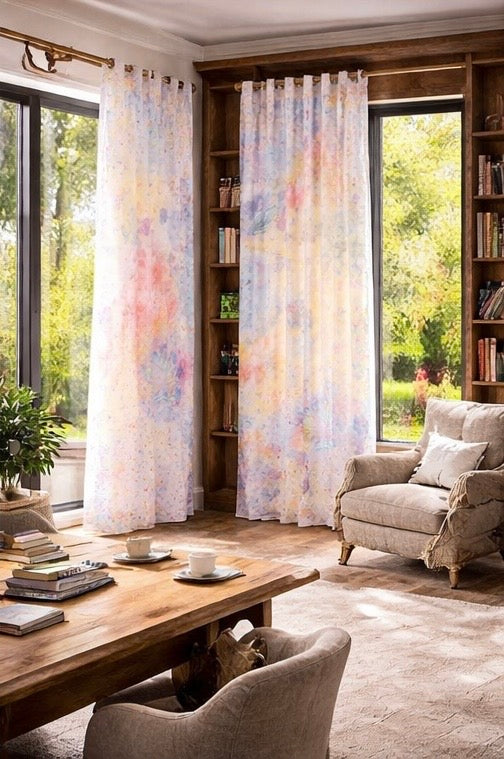 Living room with floral curtains, bookshelves, and a coffee table.