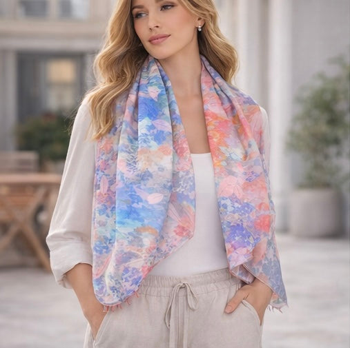 Woman wearing a MoirisArt blue and pink floral poly chiffon scarf