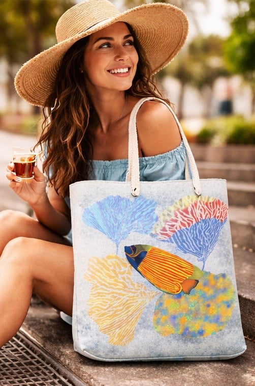 Woman holding a tote bag with a fish design outdoors