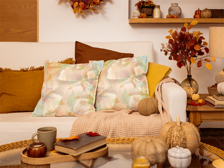 Cozy living room with autumn decorations, including pumpkins and leaves.