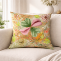 Floral-patterned pillow on a beige sofa with a blurred indoor background